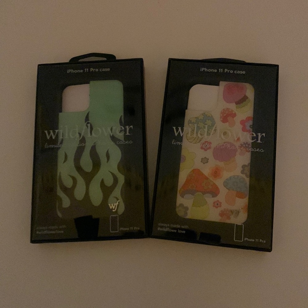 two iphone eleven pro wildflower cases